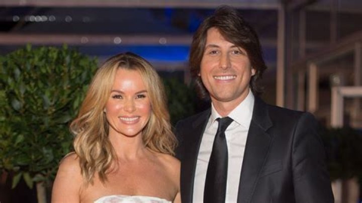 How old is Amanda Holdens husband Chris Hughes?